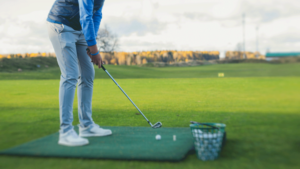 Golfer getting practicing on a driving range
